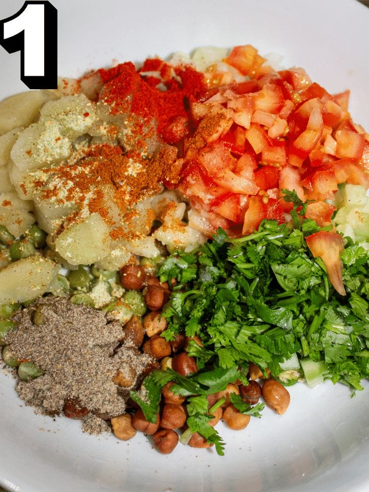 ADD SPICES AND VEGETABLE TO A MIXING BOWL.